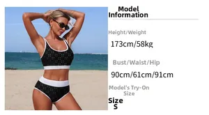 Close-up of black polka dot bikini set with white contrast trim on a sunny beach
