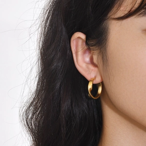 Minimalist twisted gold hoop earrings for women crafted in polished stainless steel