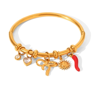 Gold stainless steel bangle with sun, bow, and red pepper charms for women's jewelry