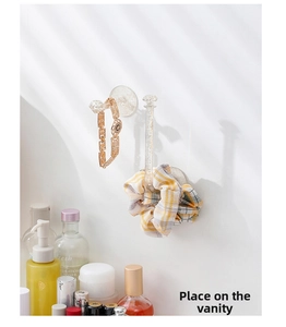 Wall-mounted acrylic clear hooks for headband and jewelry storage on vanity wall