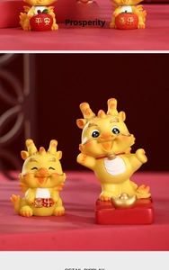 Detail view of cartoon dragon resin figurines with festive Chinese lucky charms and gold ingots