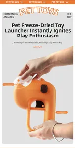 Detail of the bright orange pet treat launcher with a clear food storage compartment