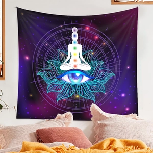 Detail of meditation tapestry with lotus, evil eye, and seven chakras on starry background