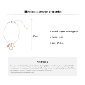 Detail view of pearl bracelet with zircon gourd pendant and copper adjustment chain