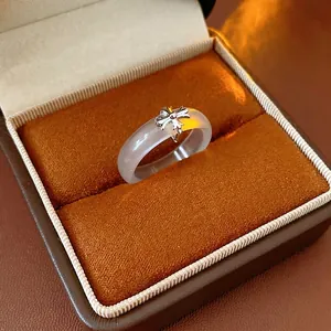 Vintage chalcedony ring with silver metal cross detail in a luxury jewelry box