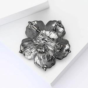 Detail view of the vintage rose brooch back showing the sturdy metal pin mechanism