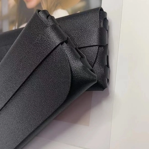 Minimalist black lychee pattern leather glasses case with a slim folding design
