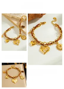 Detailed view of vintage gold-plated heart and sun charms with braided cord chain