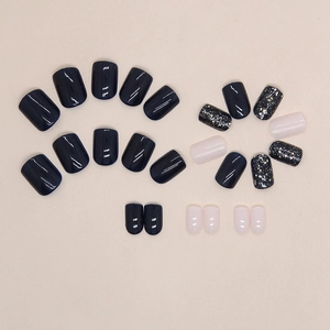 Short square navy blue and pink press-on nails with golden star glitter accents