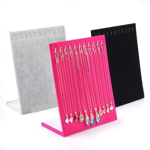 Velvet jewelry display stand for necklaces and earrings in black, gray, and rose pink