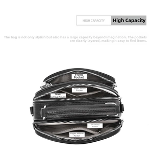 Top view of black multi-layer crossbody bag showing five spacious zipper compartments