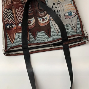 Detail view of woven cat pattern canvas tote with premium metal zipper closure