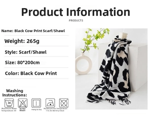 Detail showing cow print scarf texture with tassels, sized 80x200cm and 265g weight