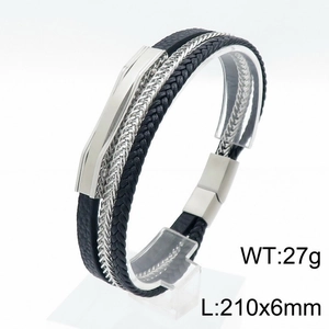 Detail view of multi-layer black braided leather bracelet with silver chain and magnetic clasp