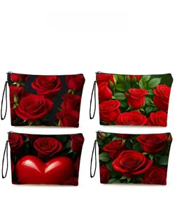 Pattern display of four rose and heart printed cosmetic bags with wristlet straps