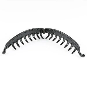 Detailed view of black plastic banana hair clip showing molded text and sturdy hinge design