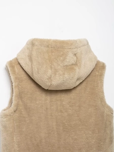Detail of hooded beige sherpa fleece vest showing plush texture and back shoulder cut
