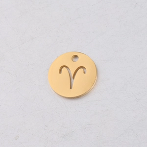 Macro shot of 12mm gold mirror finish Aries zodiac circle charm for DIY jewelry making
