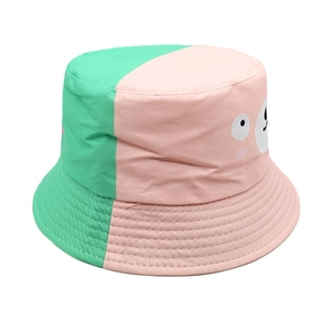 Detail of mint green and pink patchwork kids bucket hat with cute bear print and stitching