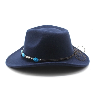 Detailed view of dark blue wide brim wool fedora with bohemian beaded cord trim