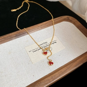 Gold stainless steel necklace with double red enamel heart pendants in retro style
