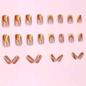Striped glitter press-on nails with warm orange wave patterns in medium length