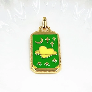 Green tarot style pendant featuring a yellow heart planet and golden moon on white waves