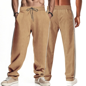Detail of khaki corduroy pants showing drawstring elastic waist and side stripes