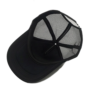 Inside view of black mesh trucker hat with breathable fabric and reinforced stitching