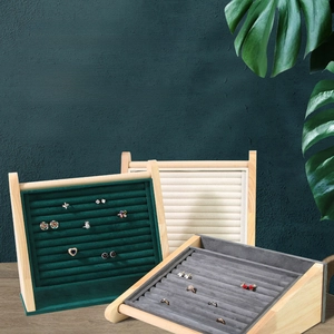 Velvet jewelry display stand with wooden frame for organizing rings and earrings