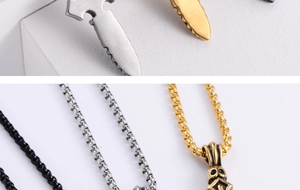 Close-up of dagger and cross pendants in gold, silver, and black finishes on box chains