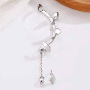 Detailed view of silver gothic claw ear cuff featuring a sharp spike and metallic chain
