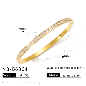 Detail view of 4mm 18K gold plated stainless steel bangle with clear cubic zirconia