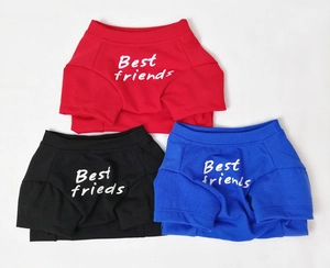 Detailed view of three cotton pet t-shirts in red, black, and blue with Best Friends print