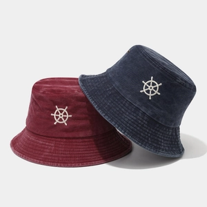 Vintage washed cotton bucket hats with nautical helm embroidery in burgundy and navy blue