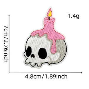 Macro detail of skull candle embroidery patch showing dimensions 7cm by 4.8cm and 1.4g weight