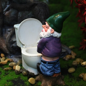 Funny garden gnome resin statue sitting on a mini toilet stool for outdoor decor
