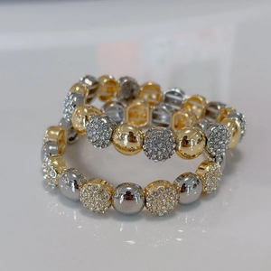 Two-tone brass beaded bracelets with micro-pave zircon charms for a trendy look