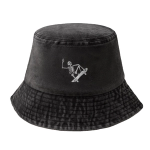 Washed black cotton bucket hat featuring a white skeleton skateboarder graphic print