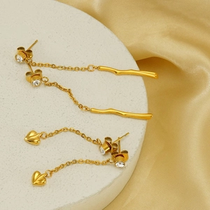 Elegant gold-plated tassel earrings featuring branch and heart pendants with zircon accents