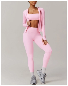 Three-piece pink yoga set including hooded zip jacket, sports bra and leggings