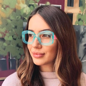 Fashionable oversized square blue frame glasses with colorful patchwork temple details