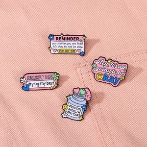 Pink enamel lapel pin set with mental health slogans for backpacks and clothing