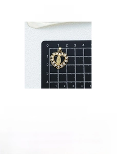 Detail view of 18K gold plated heart pendant with Virgin Mary relief and zircon stones