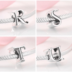 Detailed view of S925 silver R, S, T, U alphabet charms for DIY charm bracelets