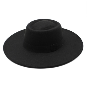 Classic black wool fedora hat with wide brim and decorative matching band for winter