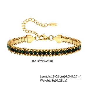 Detail of gold curb chain bracelet with green zircon and K18 hallmark tag