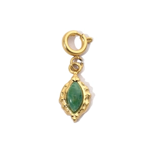 Detailed view of a vintage gold-plated spring clasp pendant with green natural stone