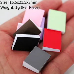 Miniature dollhouse colorful books in hand showing 15.5x21.5x3mm scale for BJD scenes