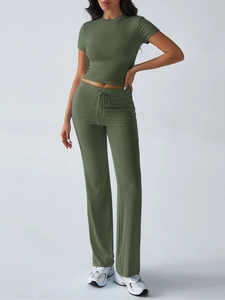Detail of dark green two-piece lounge set with drawstring waist and soft cotton fabric